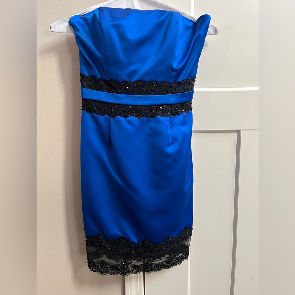 Andrew Adela: blue and black dress